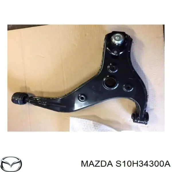 Важіль передньої підвіски нижній, правий S10H34300A Mazda