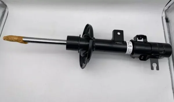 Амортизатор передній, правий TK5034700B Mazda