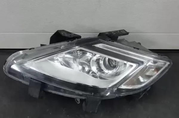Фара ліва TG31510L0C Mazda