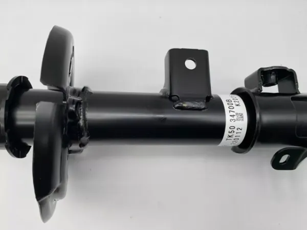 Амортизатор передній, правий TK5034700B Mazda