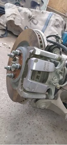 Супорт задній лівий L1MZ2553E Ford