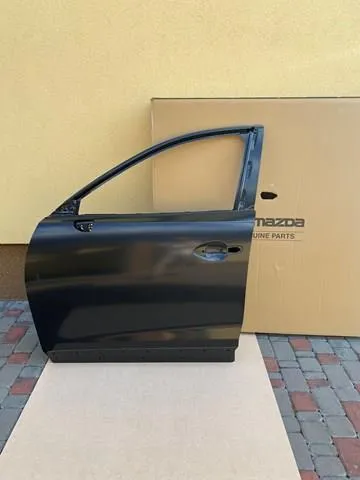 Двері передні ліві TKY05902XC Mazda