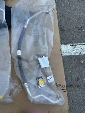 Шланг кондиціонера, від випарника до компресора 7700434385 Renault (RVI)